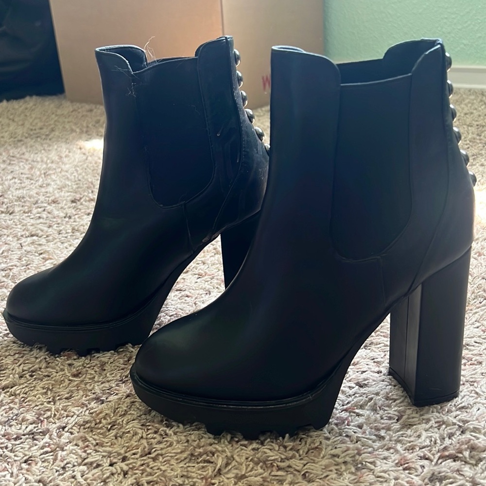 Selling brand new, not worn, platform, black booties. Size 8. Brand is ASOS